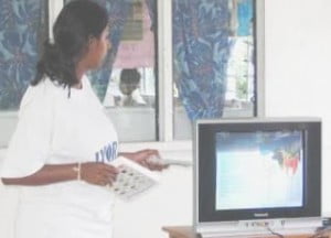Chin explaining coral morphology on new television and DVD set donated by Christine’s family in Switzerland to Uluinakorovatu School.